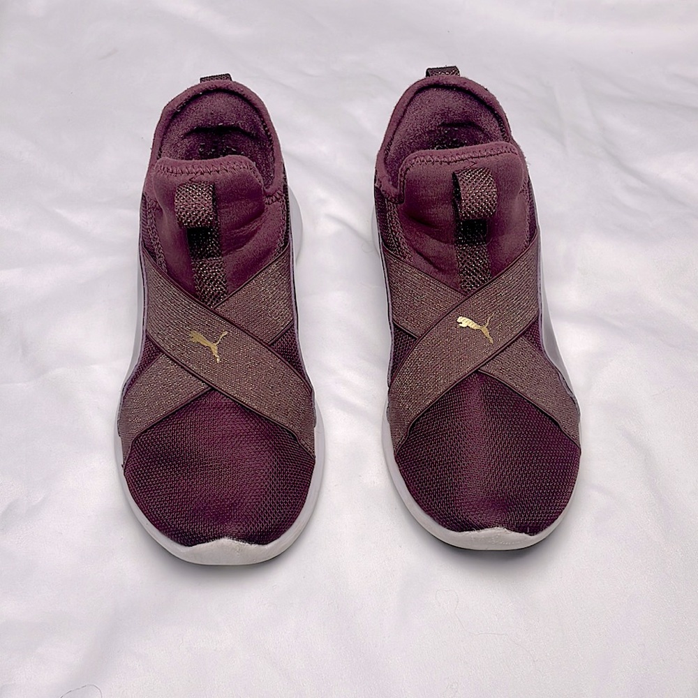 Maroon and gold slip on PUMA sneakers